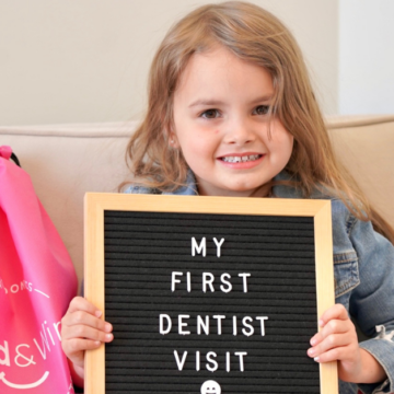 A young child at her first dentist visit in Clarendon Hills, Illinois.